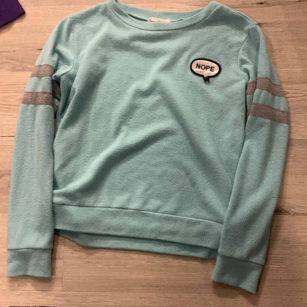Blue shirt with nope on it